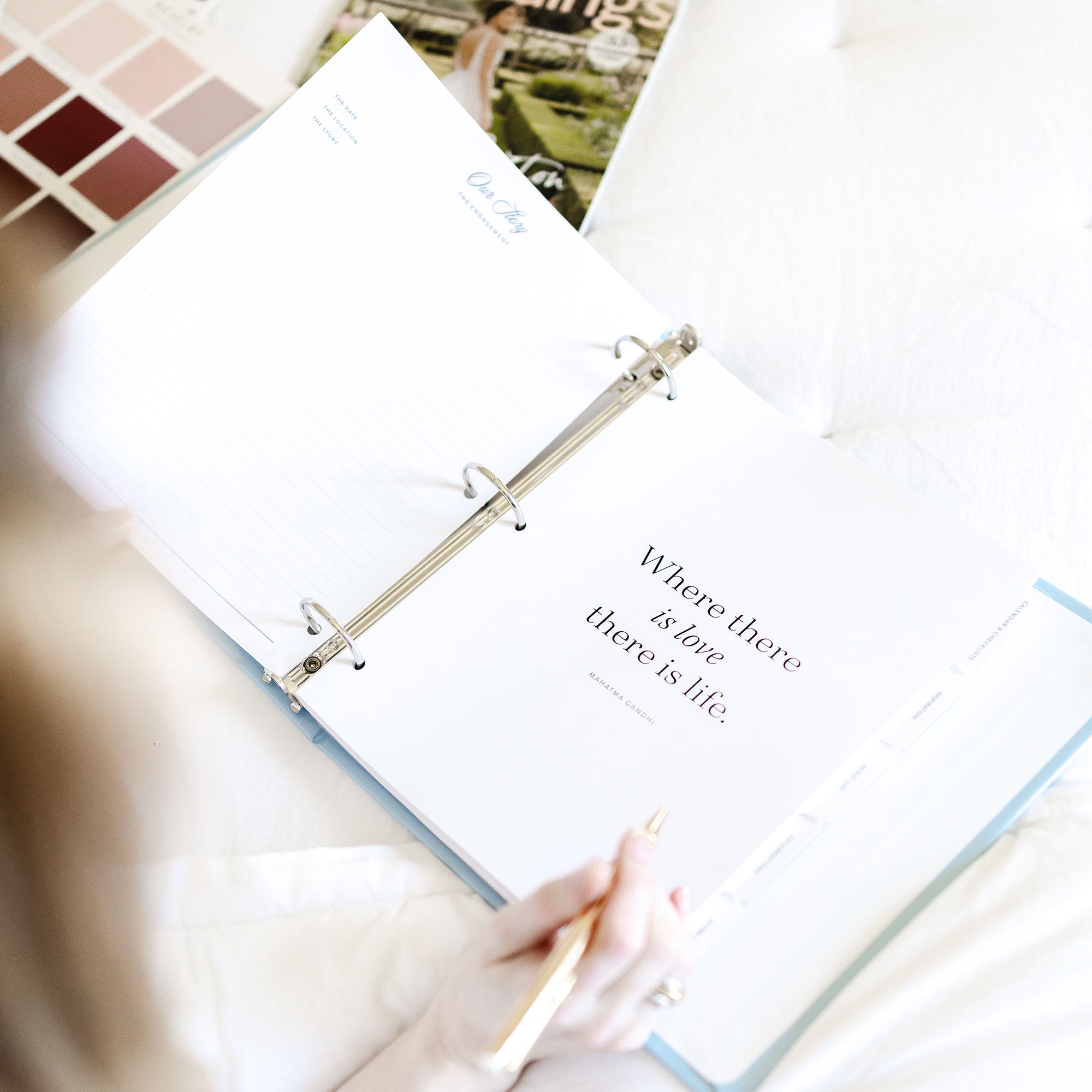 Keepsake Paper Co. wedding planning binder with elegant script lettering on a white cover