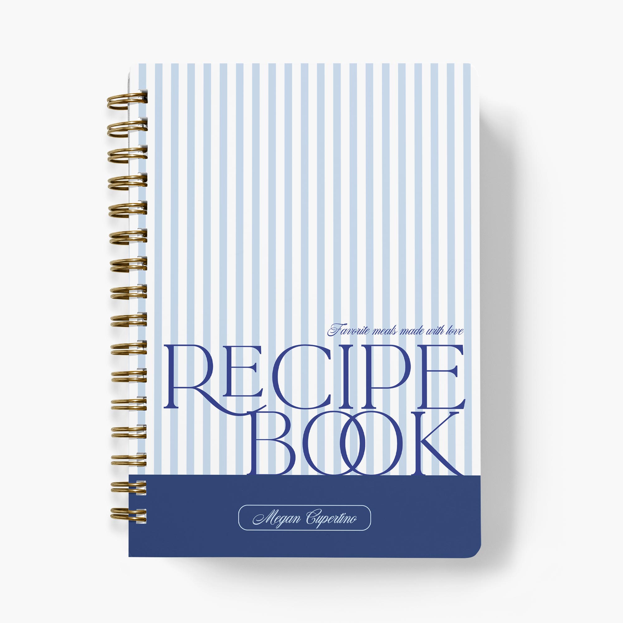 Custom recipe journal with a classic stripe design in blue and white, paired with bold text and bound with gold wire