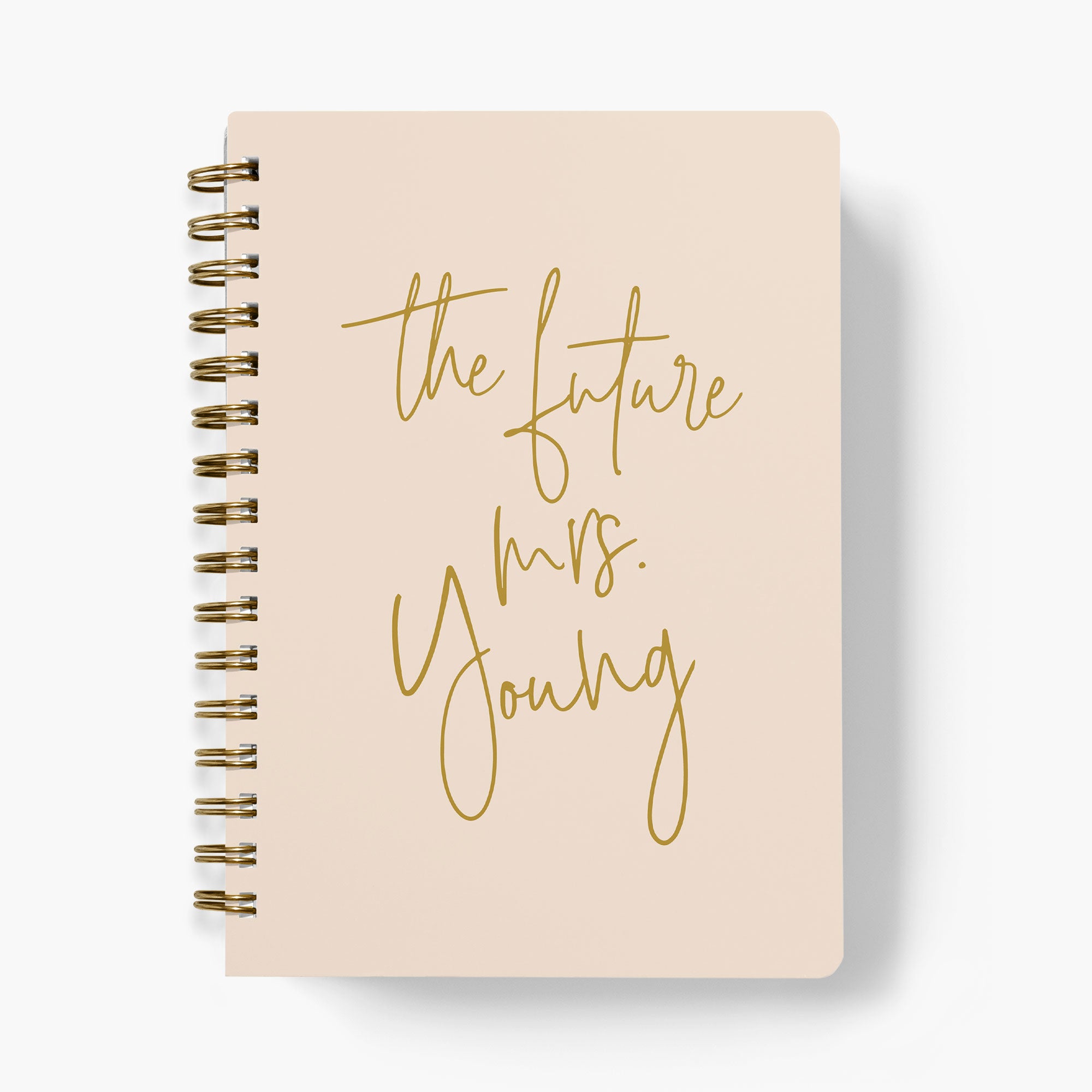 Personalized wedding planner with 'the future mrs.' text on a blush pink background