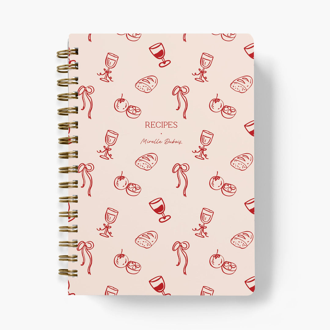 Custom recipe journal with a French inspired wine and bread pattern in pink and red on a white background