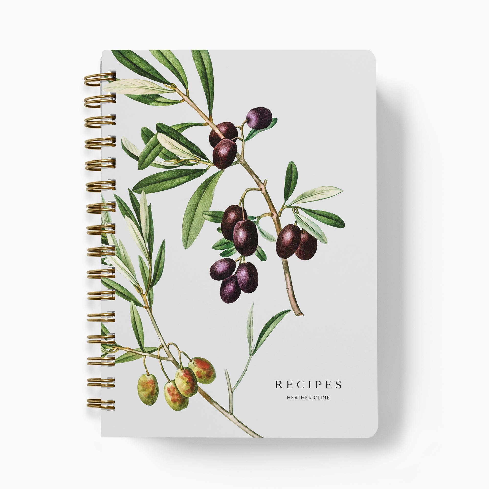 Custom cookbook with olive branch illustration on a white background