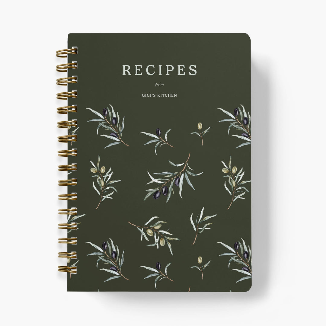 Custom recipe book with olive branch design on a dark green background