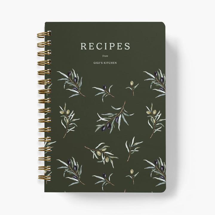 Custom recipe book with olive branch design on a dark green background