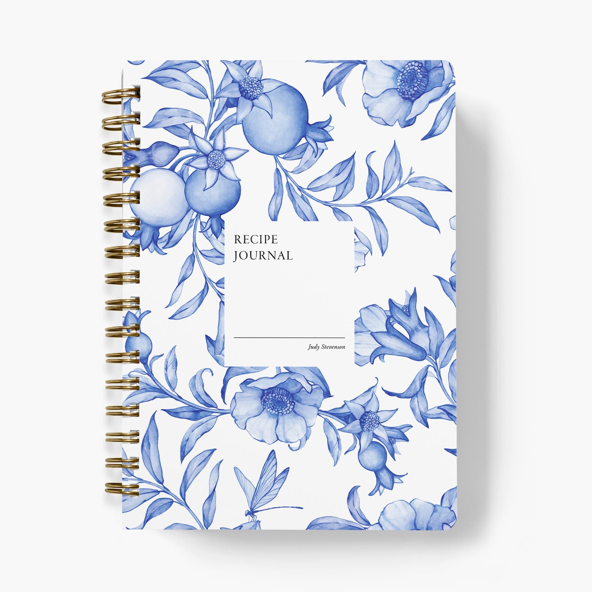 Custom recipe journal with blue and white floral design on a white background