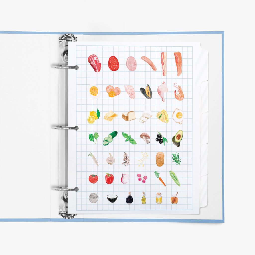 Recipe tab dividers with food illustrations on a grid background in a ring binder