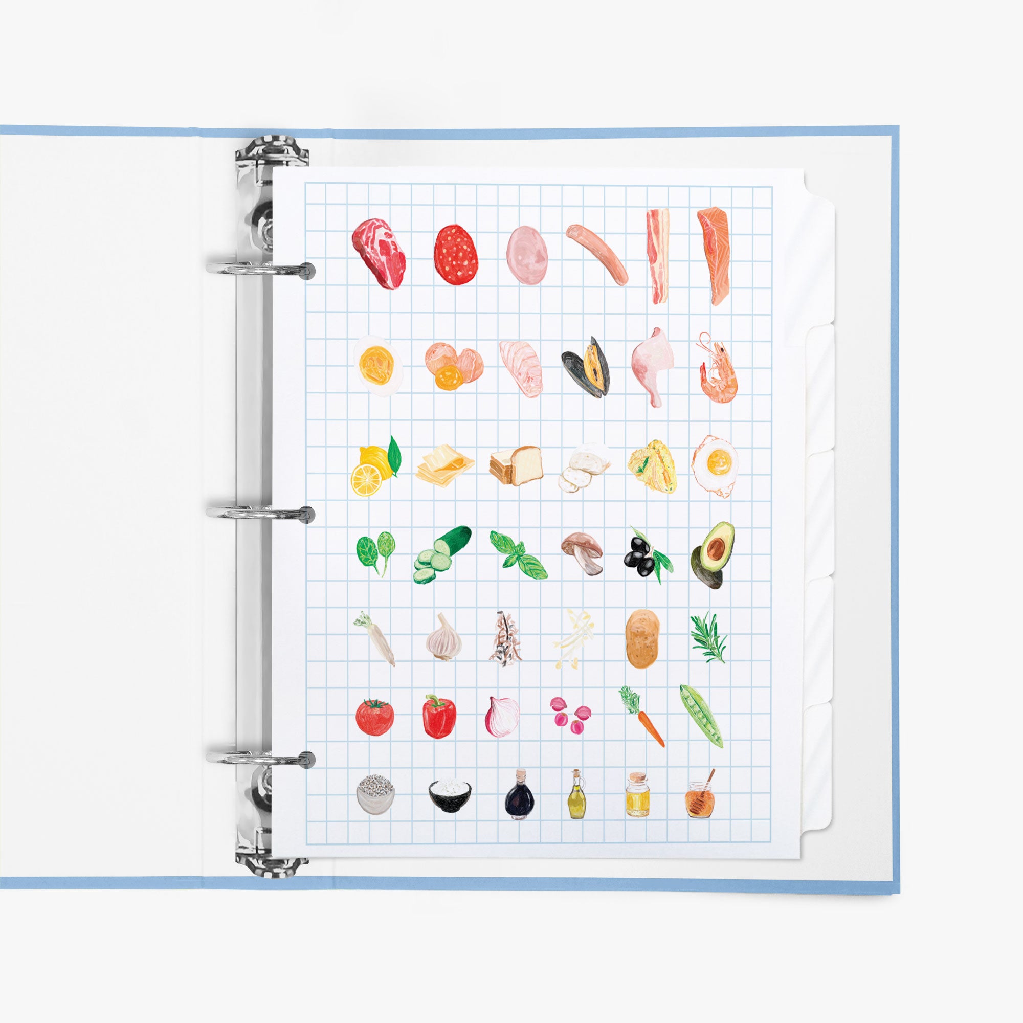 Recipe tab dividers with food illustrations on a grid background in a ring binder