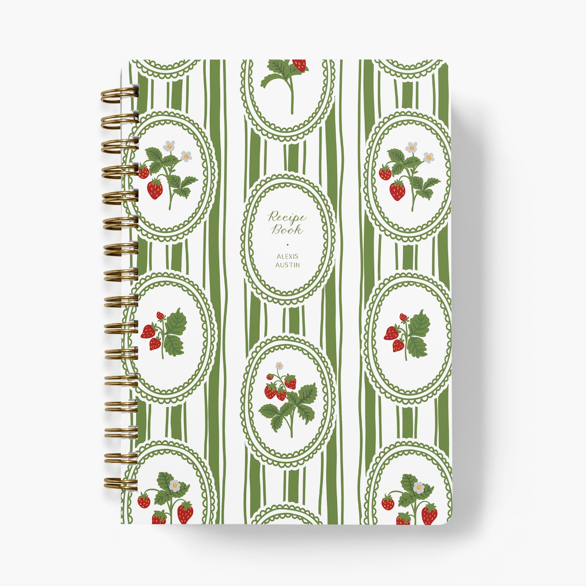 Custom recipe book with green and white striped cover featuring strawberry illustrations on a white background