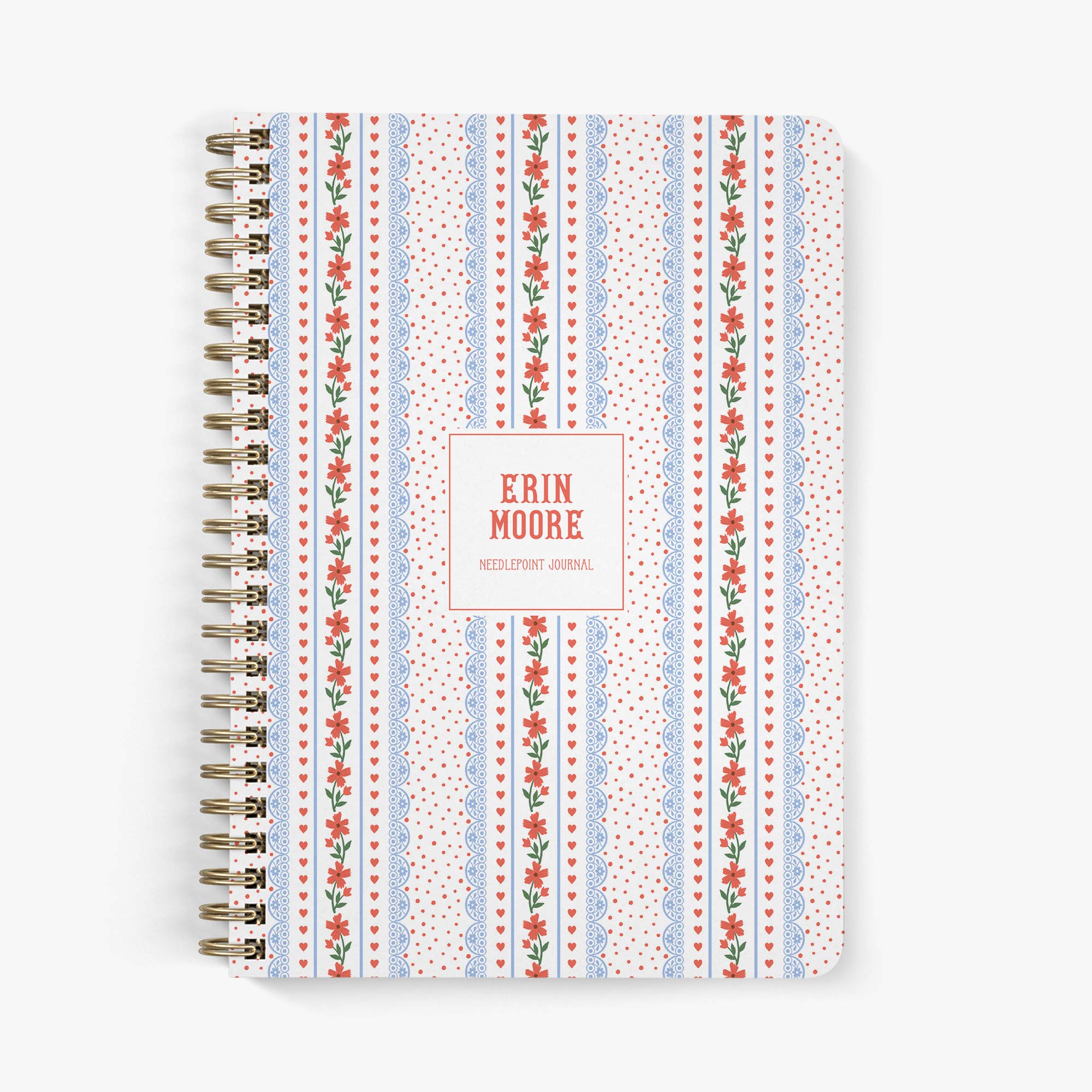 Custom needlepoint journal with Americana-inspired floral pattern with hearts on a white background