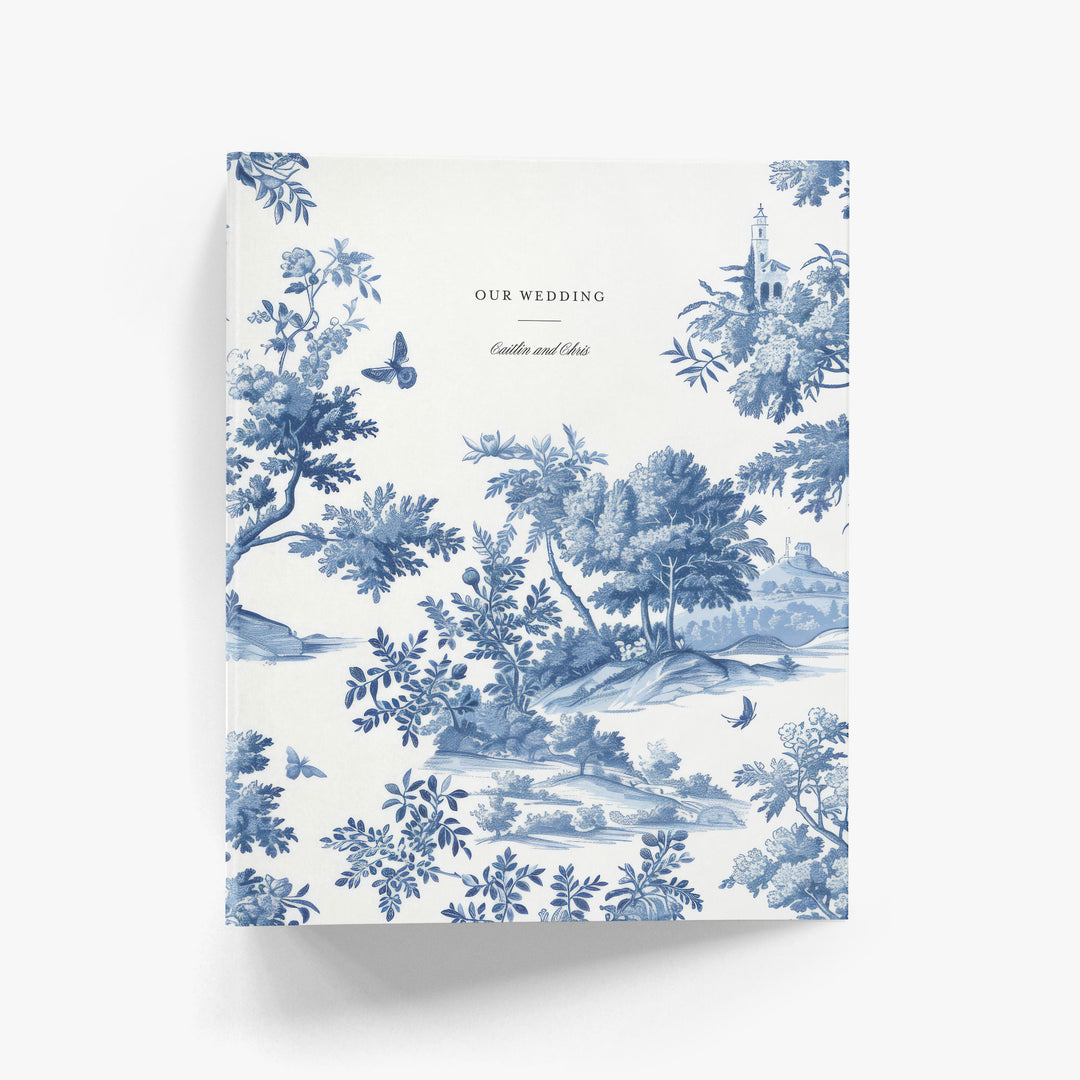 Custom wedding planning binder with blue and white toile pattern on a white background