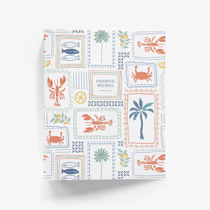 Custom cookbook with a colorful Italian sea-themed cover on a white background