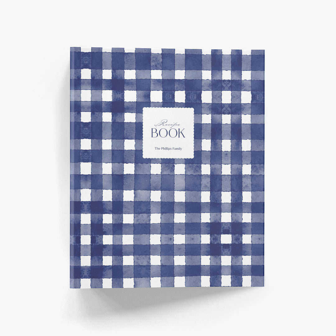 Custom recipe book with blue and white gingham pattern on a white background