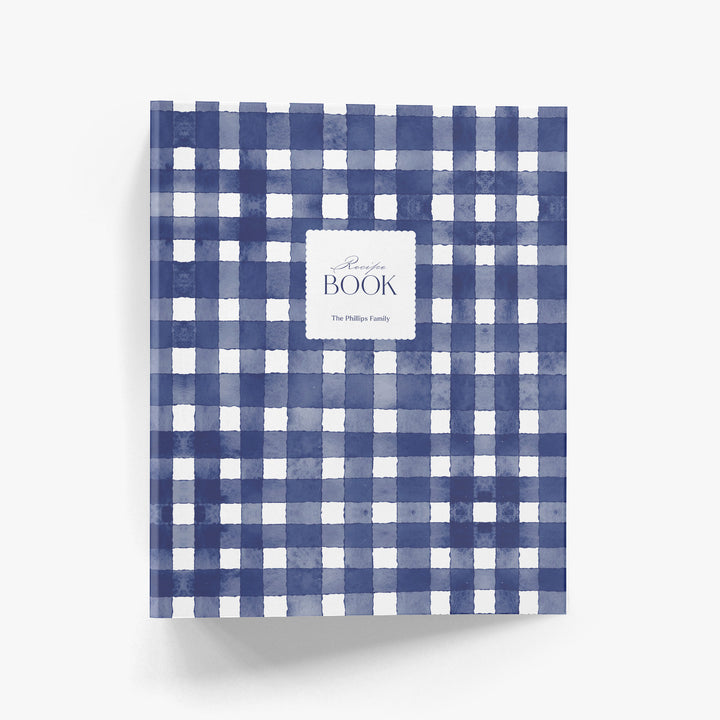 Custom recipe book with blue and white gingham pattern on a white background