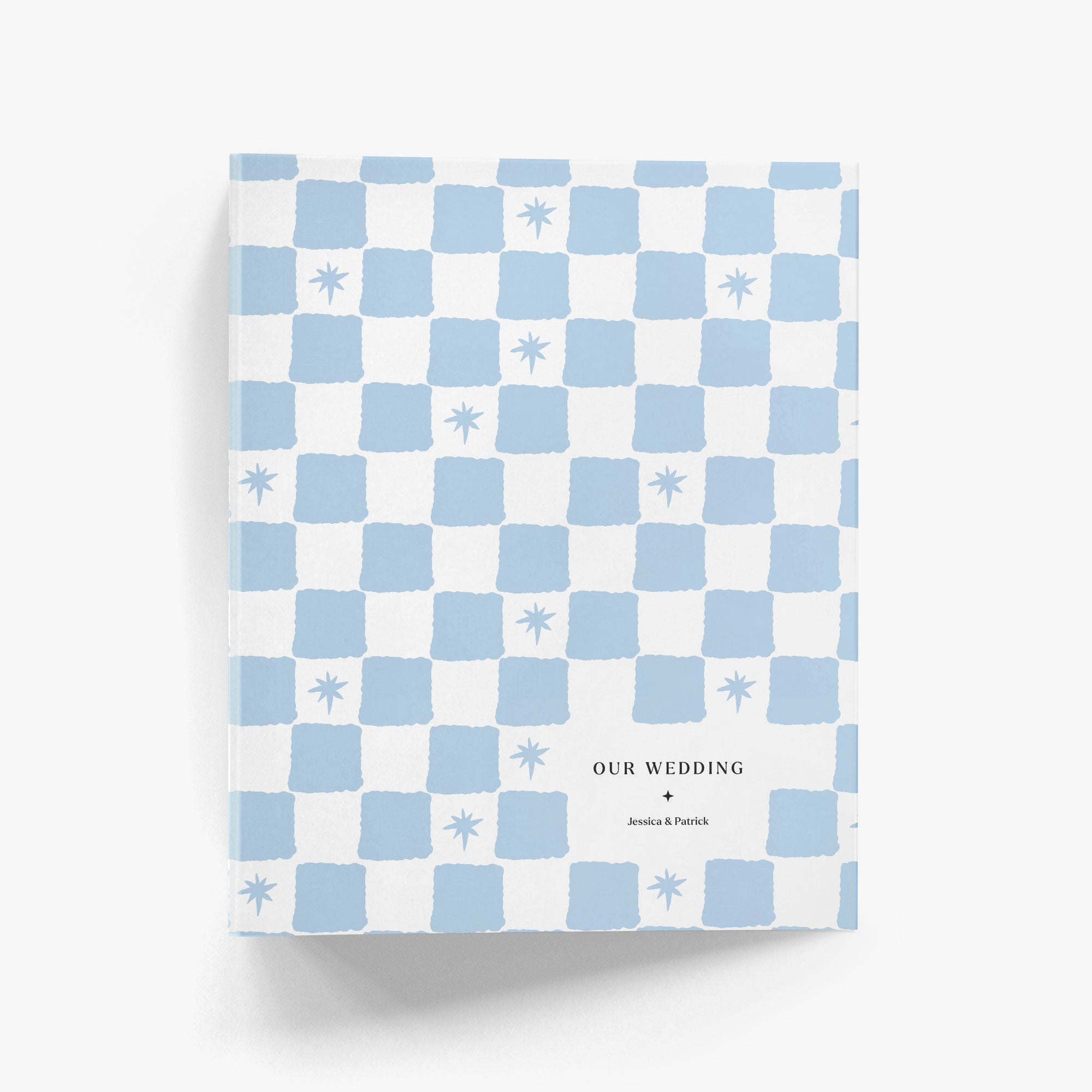 Checkered custom binder with blue and white pattern and 'Our Wedding' text on a white background