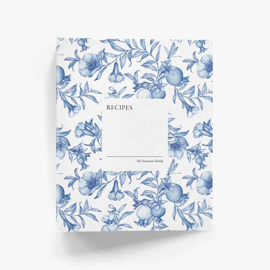 Blue and white toile custom recipe book with blue flowers on a white background