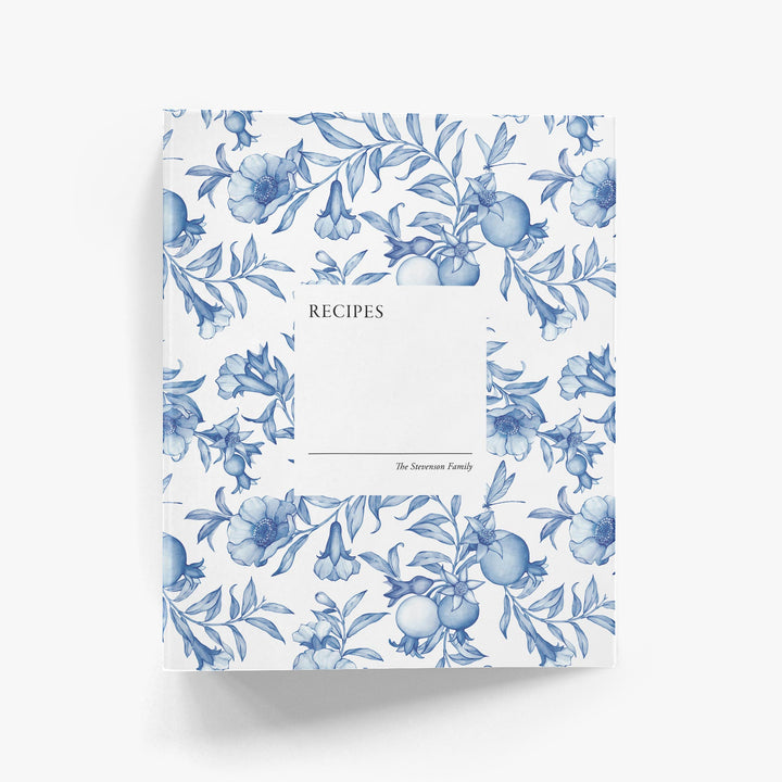Blue and white toile custom recipe book with blue flowers on a white background
