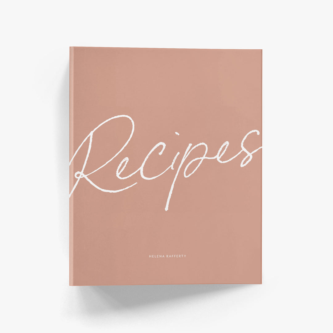 Custom recipe binder with bold calligraphy script says 'Recipes' on the cover above your personalization.