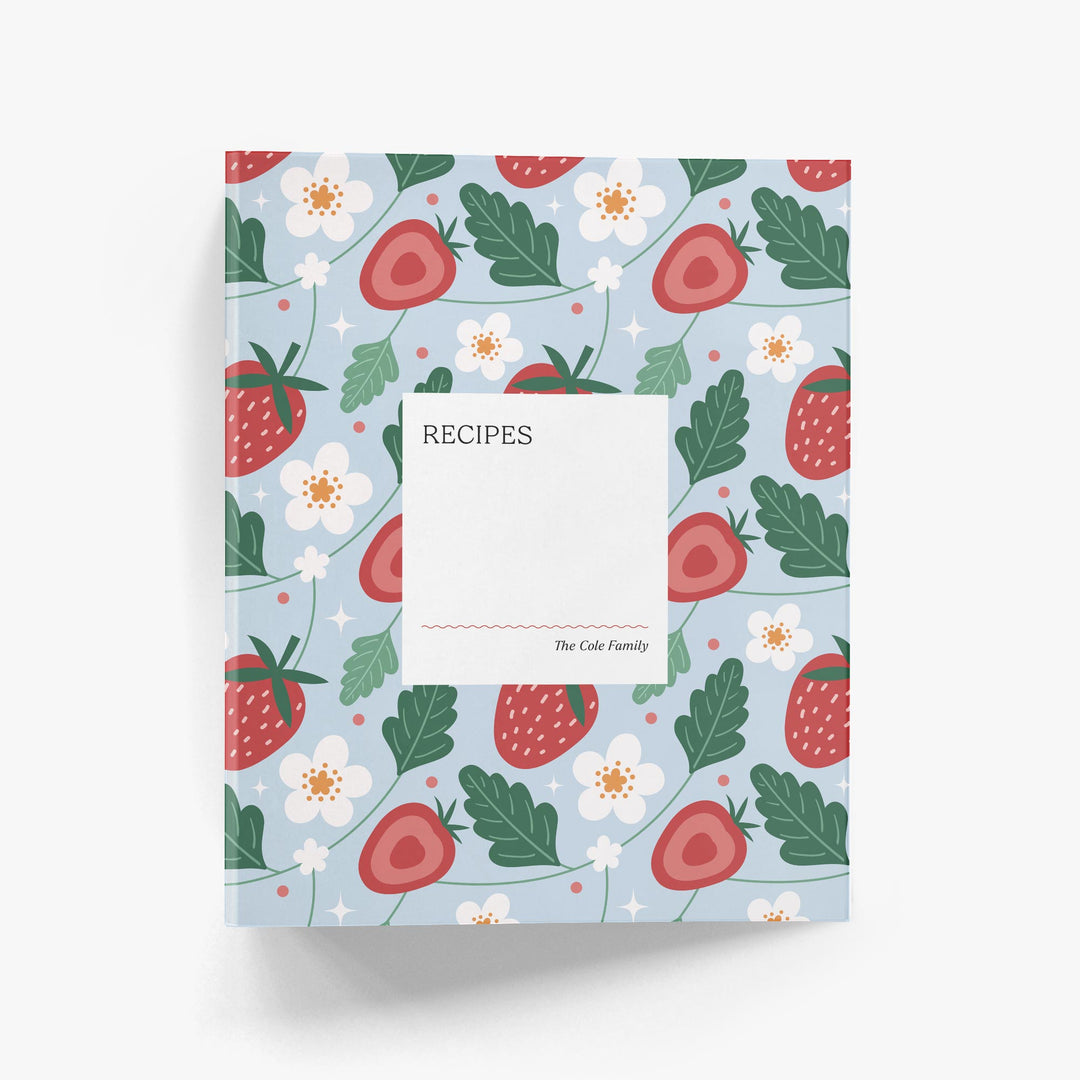 Custom recipe book with strawberry and flower pattern on a light blue background