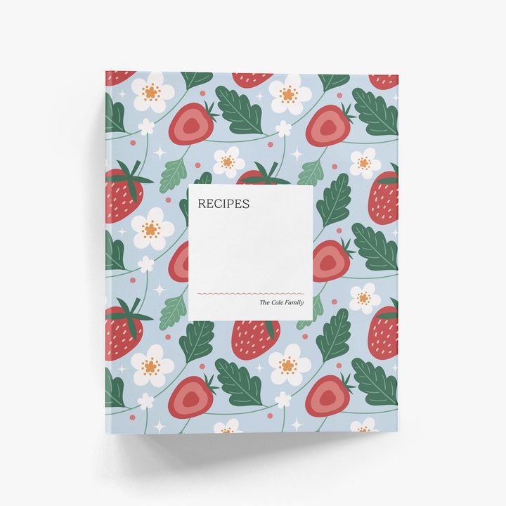 Custom recipe book with strawberry and flower pattern on a light blue background