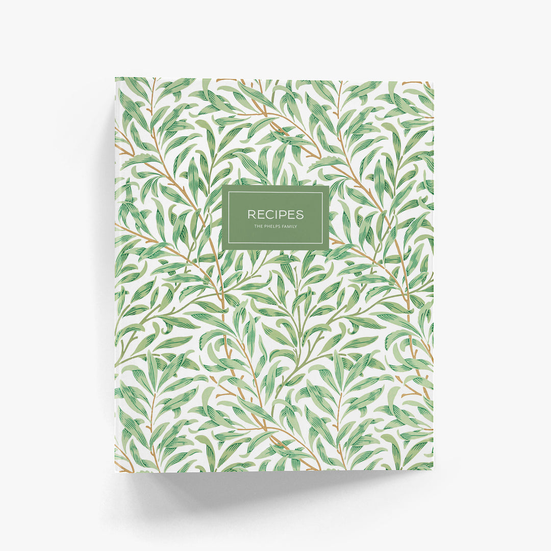 Personalized recipe binder in art-deco inspired green and white willow pattern on a white background