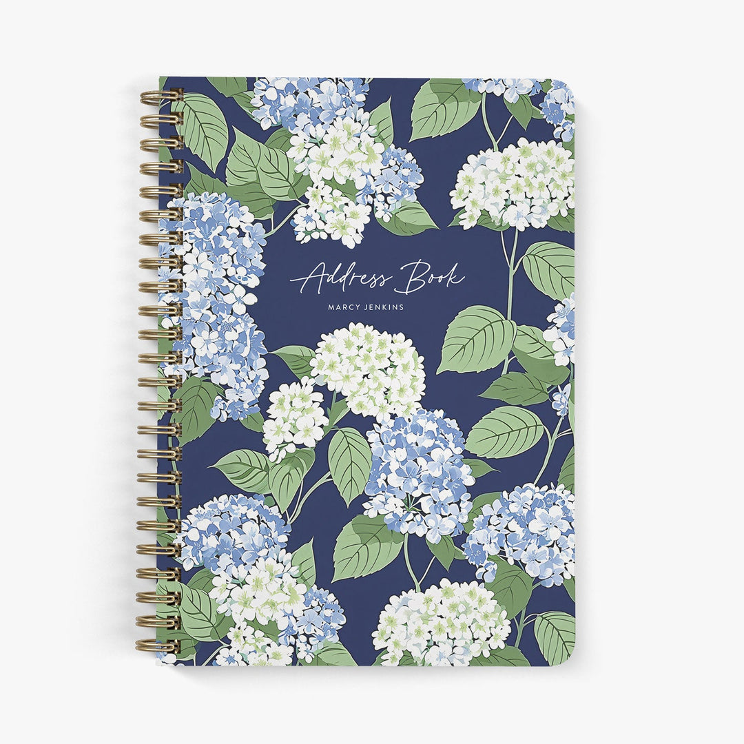 Personalized address book with blue and white hydrangea floral design on a white background