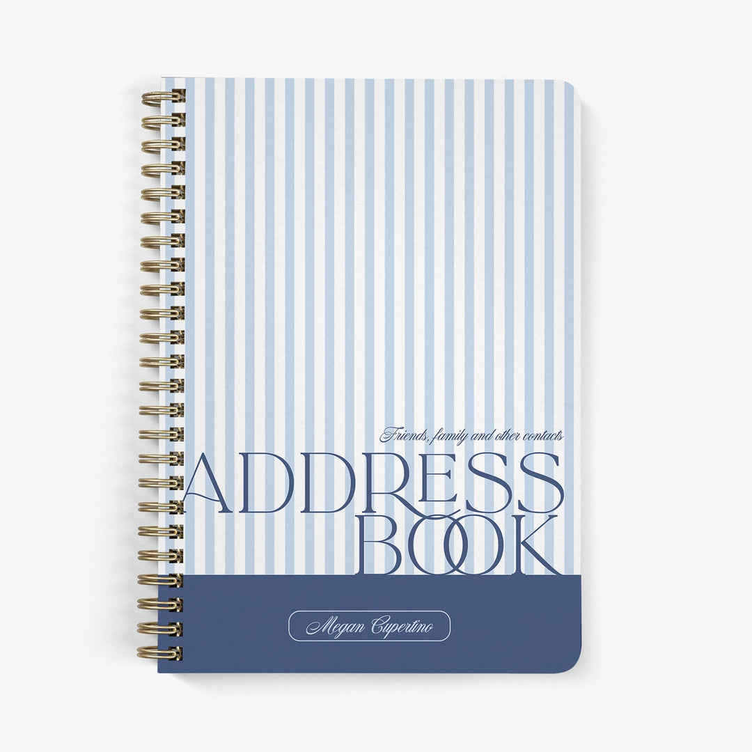 Custom address book with blue and white striped cover on a white background