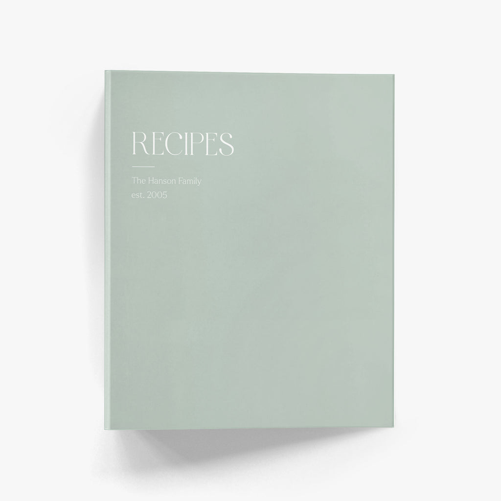 Personalized recipe binder with a minimalist, modern editorial design that reads 'RECIPES' at the top with your family name below.