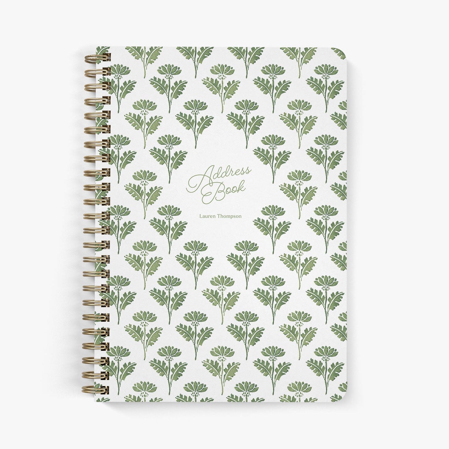Custom address book with green and white floral ink block pattern on a white background