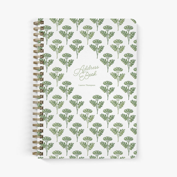 Custom address book with green and white floral ink block pattern on a white background