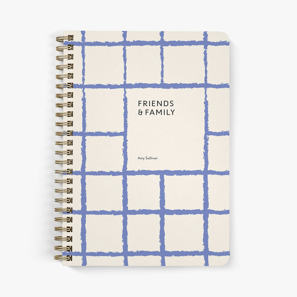 Address notebook with blue grid pattern and 'Friends & Family' text on a white background