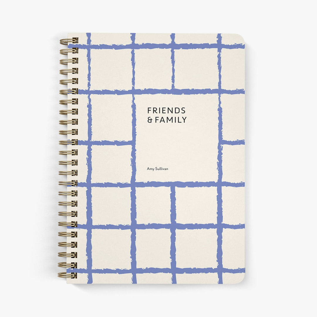 Address notebook with blue grid pattern and 'Friends & Family' text on a white background
