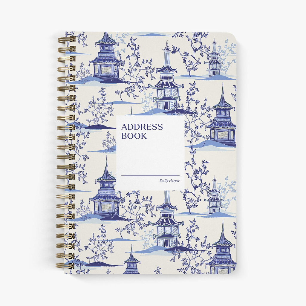 Custom address book with blue and white pagoda design on a white background