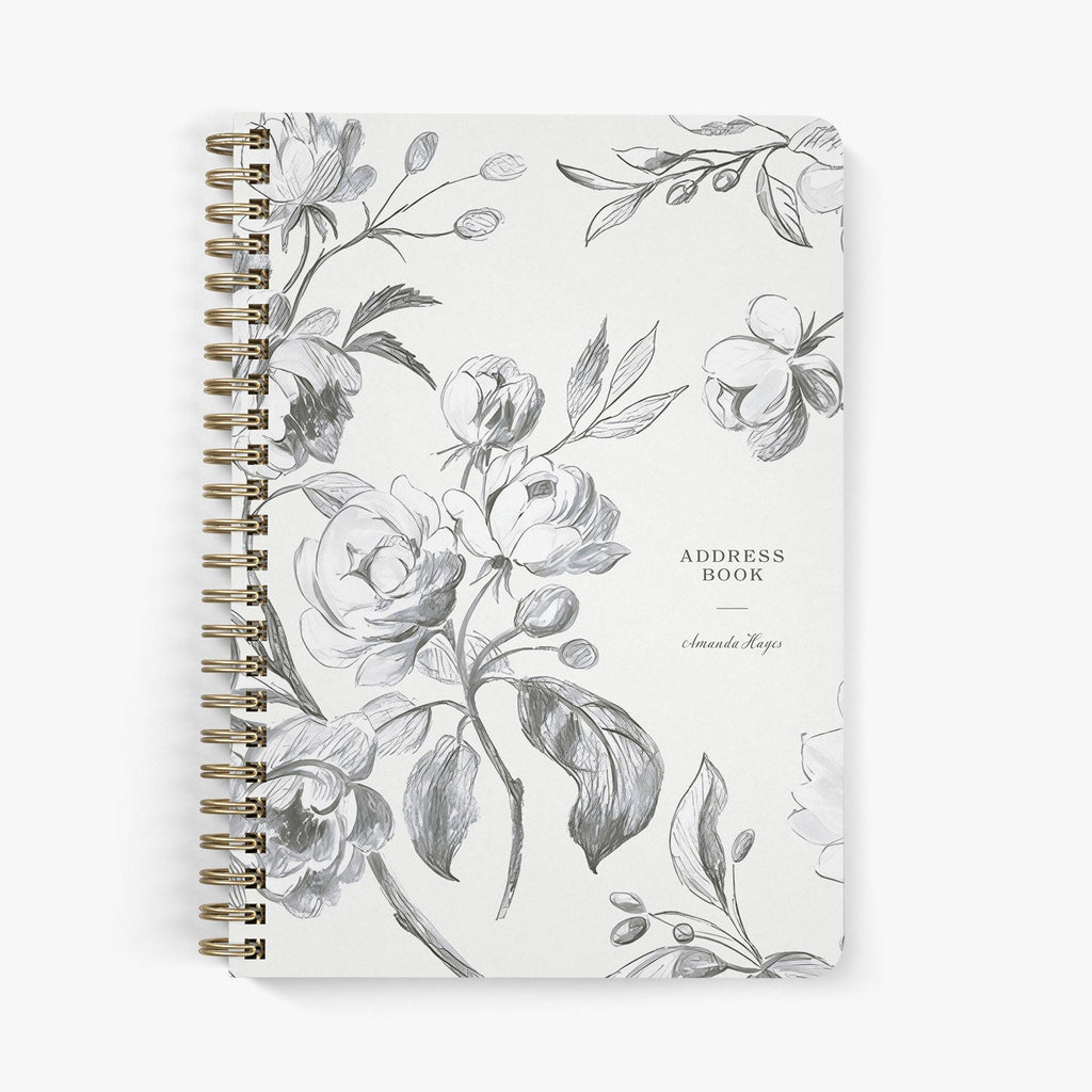 Custom address book with sketched floral design on a white background