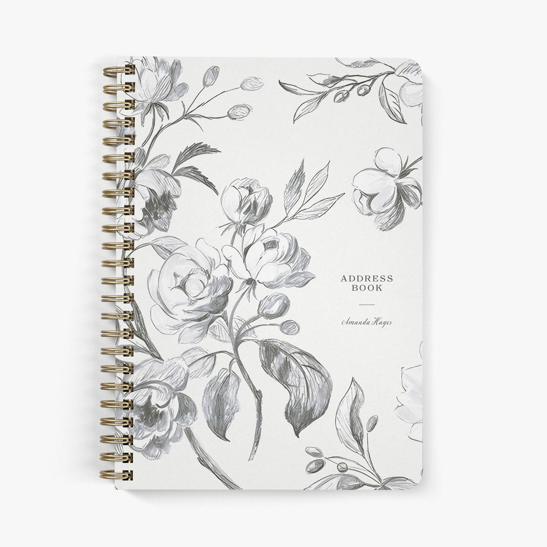 Custom address book with sketched floral design on a white background