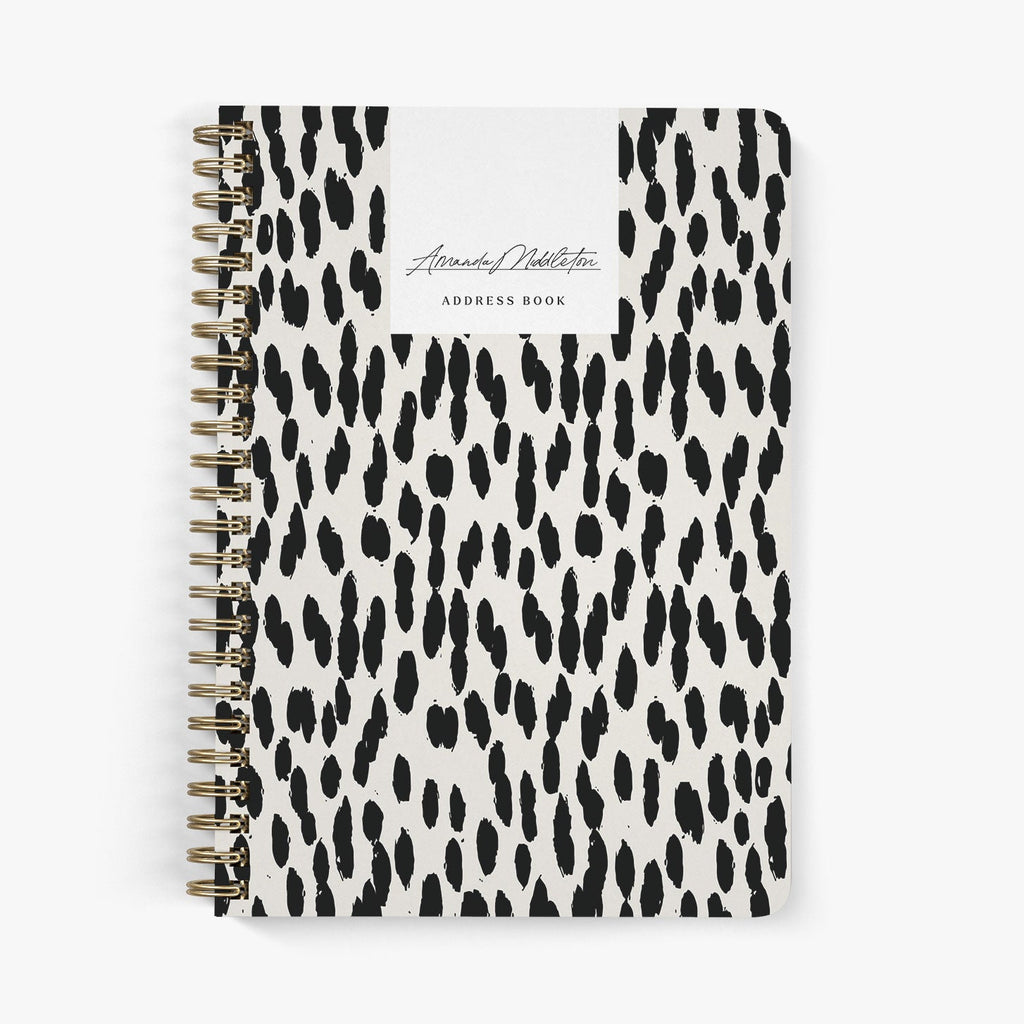 Custom address book with black and beige leopard print cover on a white background