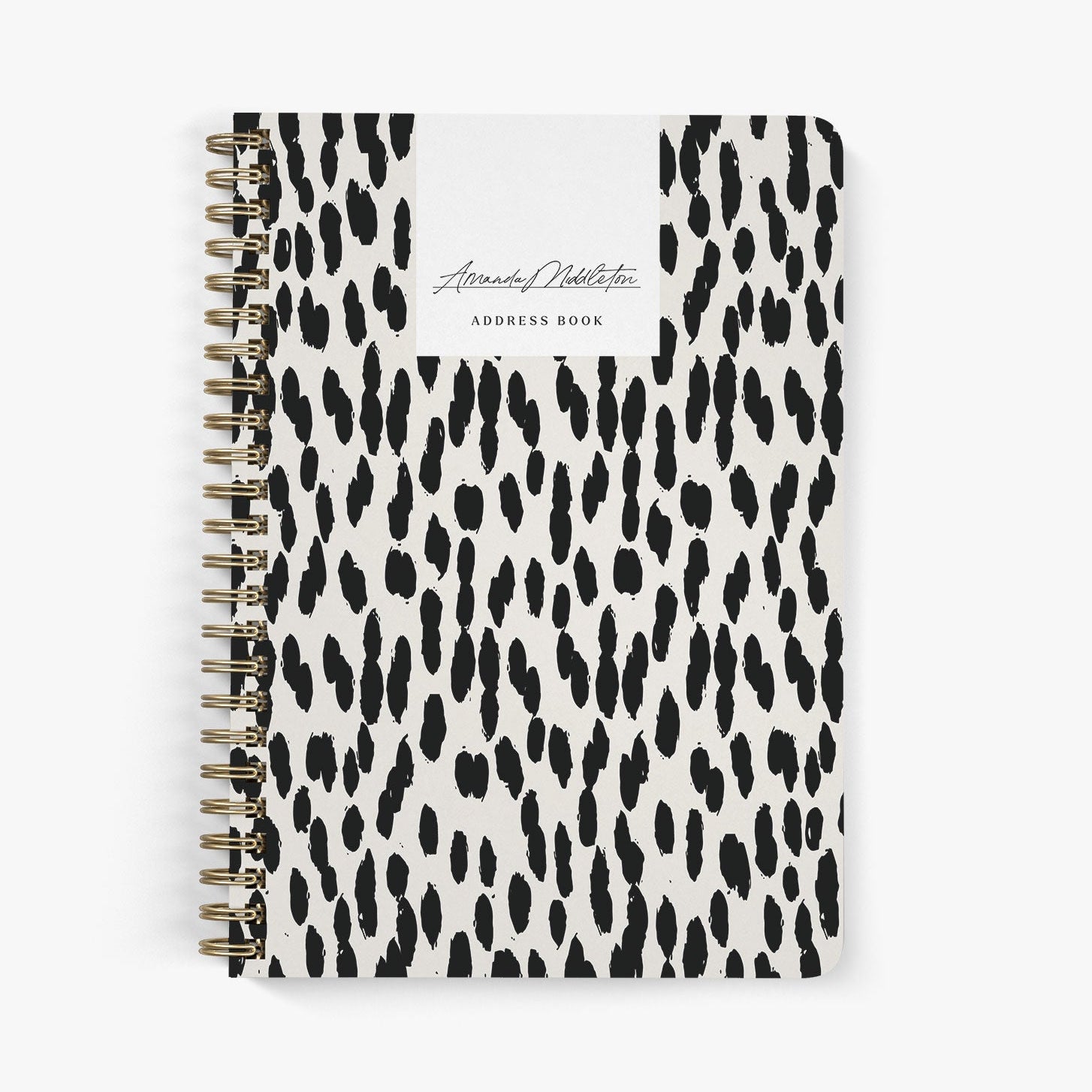 Custom address book with black and beige leopard print cover on a white background