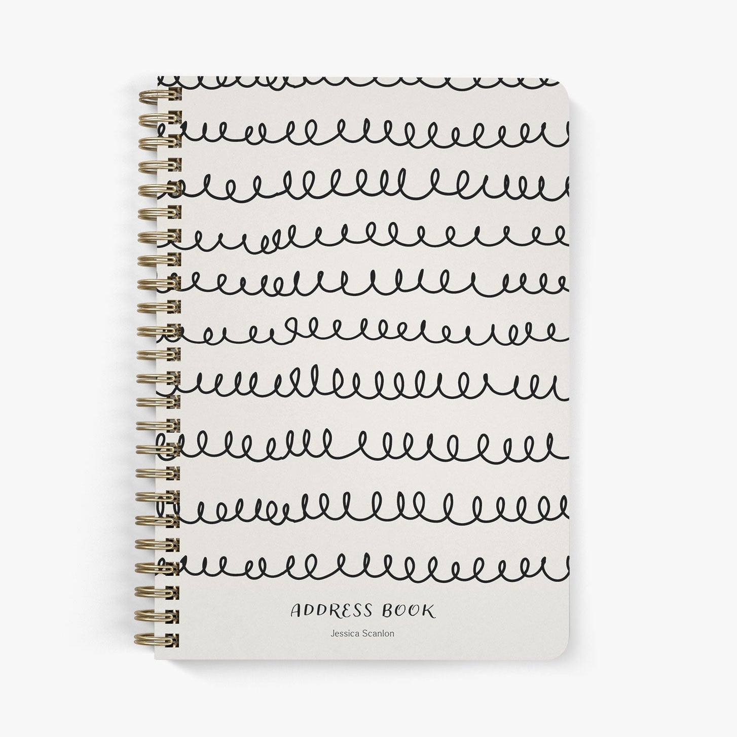 Custom address book with whimsical squiggle design in black on a beige cover