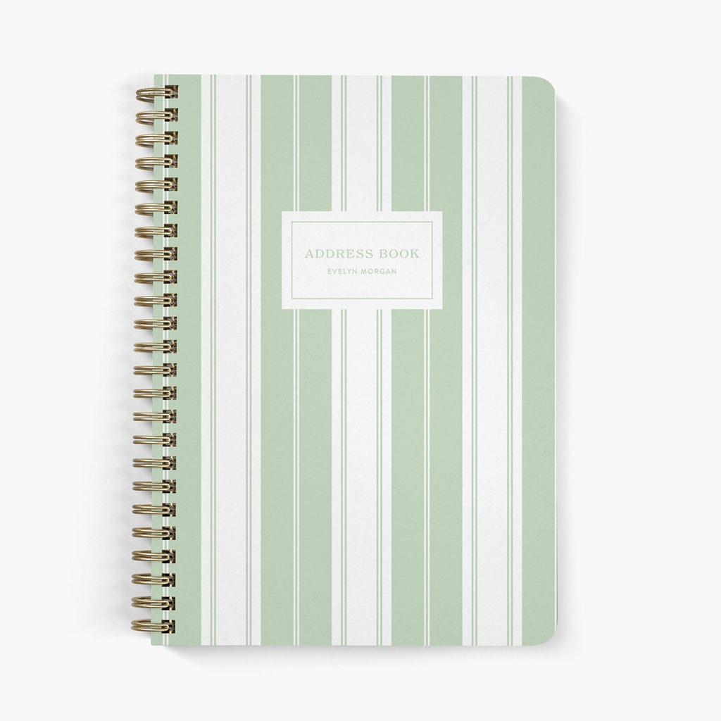 Custom address book with green and white striped cover on a white background