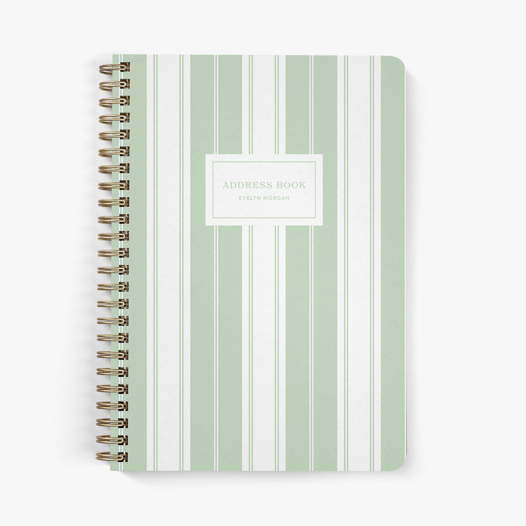 Custom address book with green and white striped cover on a white background