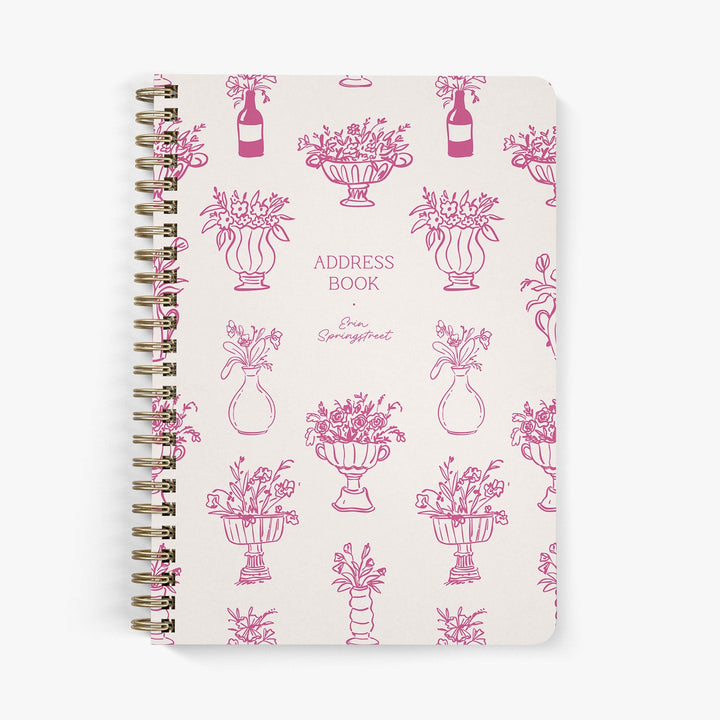 Custom address book with whimsical flowers in hand drawn vases in shades of pink on a white background