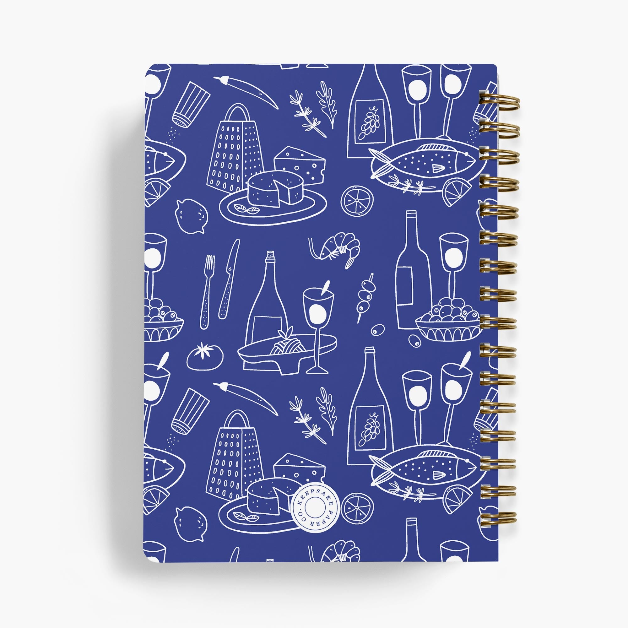 Personalized recipe notebook with a blue cover featuring white food and drink illustrations on a white background