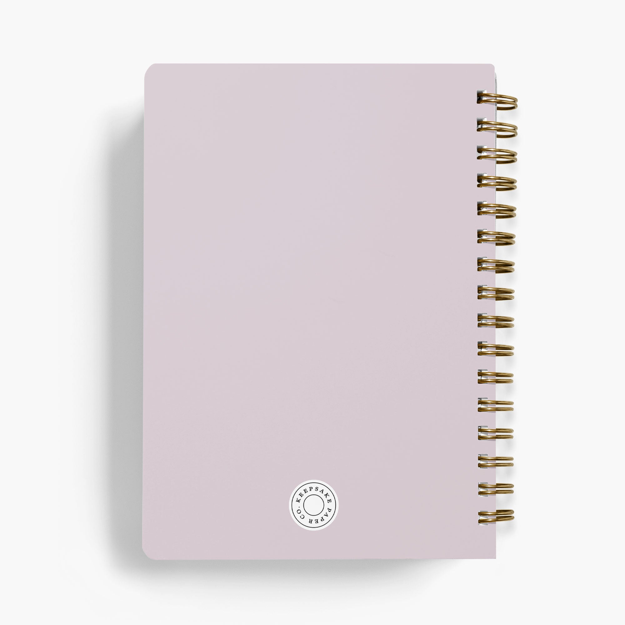 Back view of a wedding notebook with gold spiral binding on a white background
