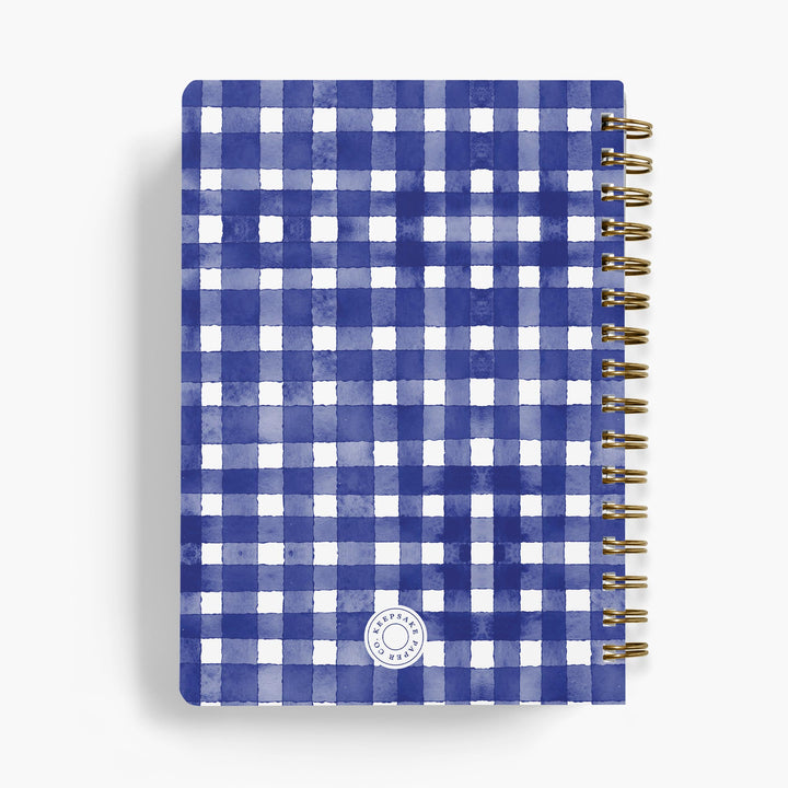 Spiral-bound personalized recipe notebook with blue and white checkered pattern on a white background