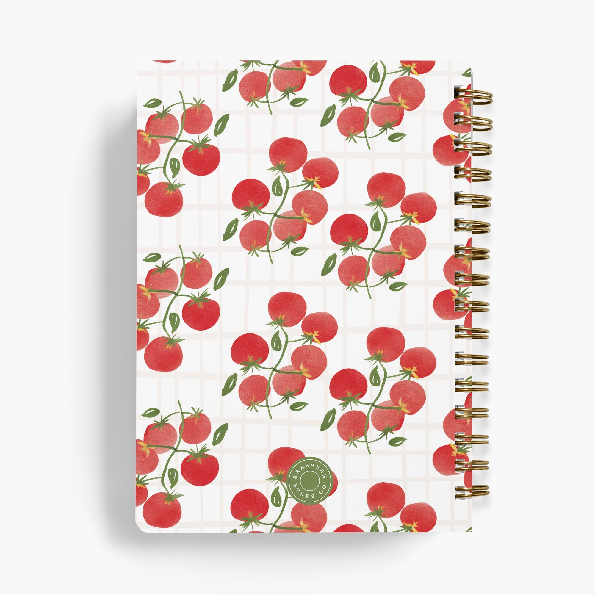 Personalized recipe notebook with cute tomato design bound with gold wire on white background