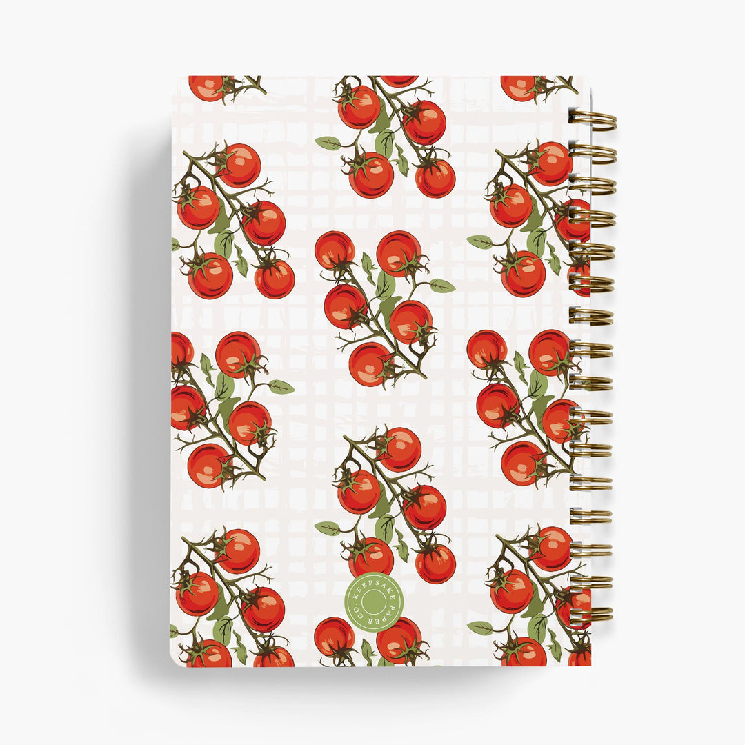 Personalized recipe notebook with cute tomato design bound with gold wire on white background