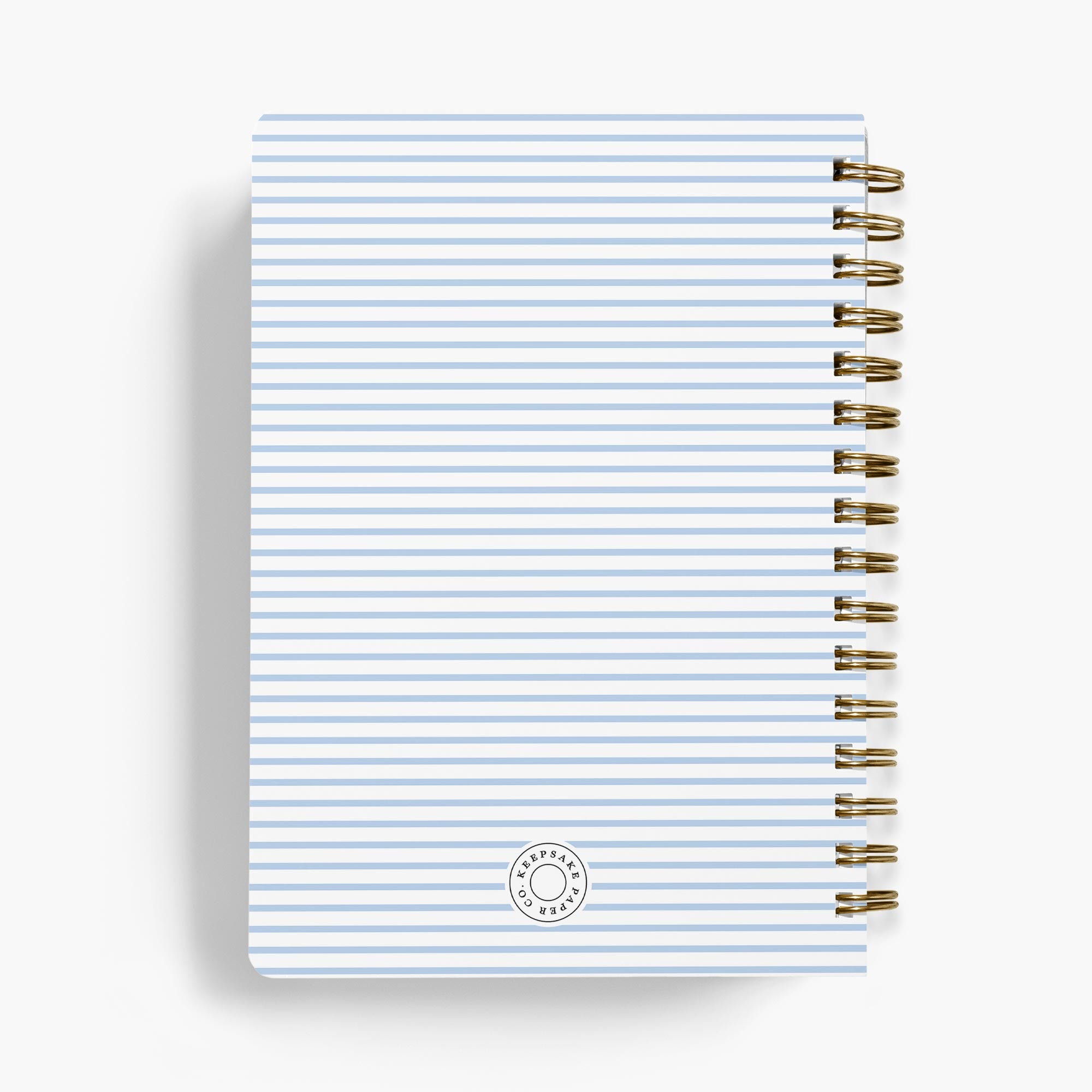 Personalized recipe notebook with striped cover and gold spiral binding on a white background