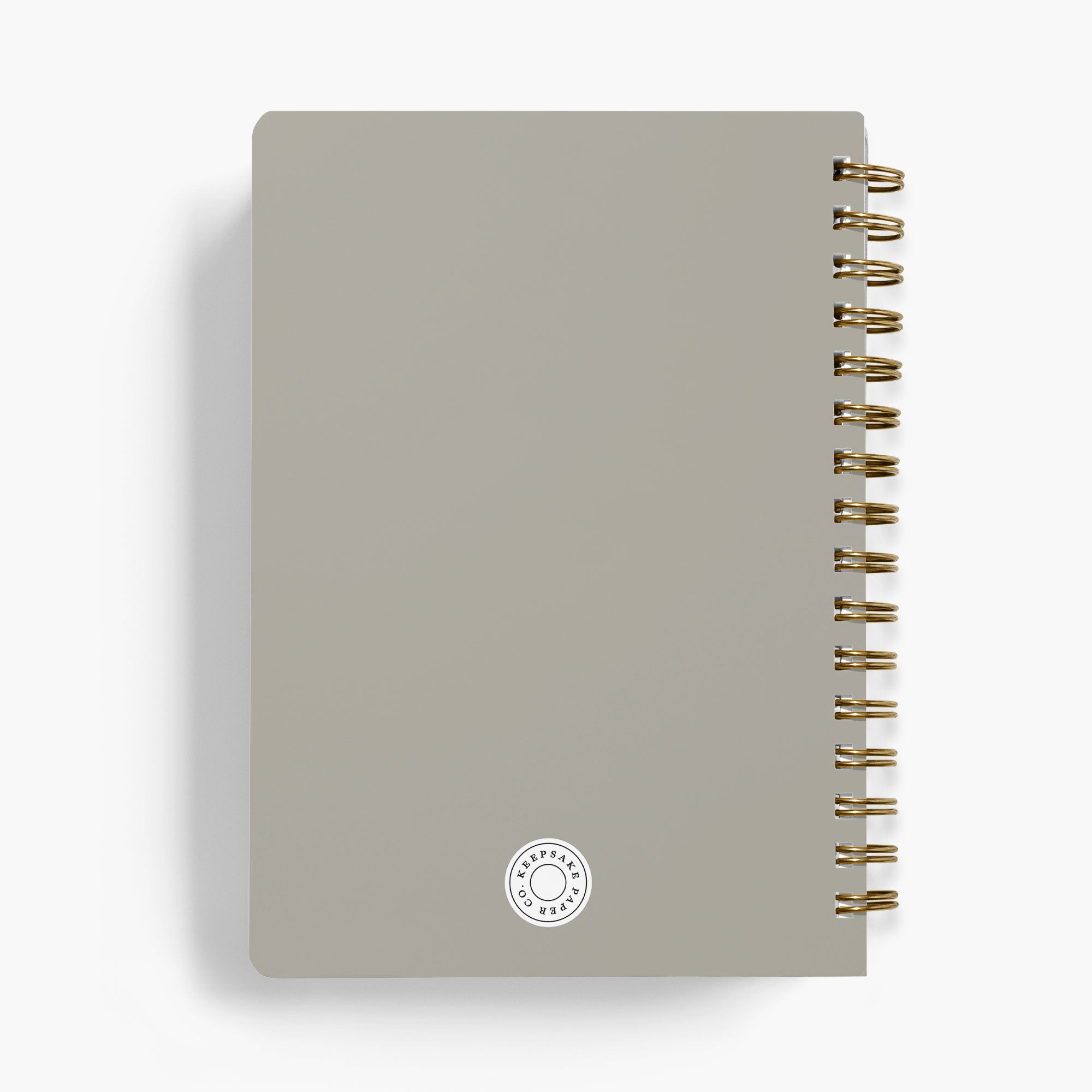 Back view of a personalized LGBT wedding planner with gold spiral binding on a white background