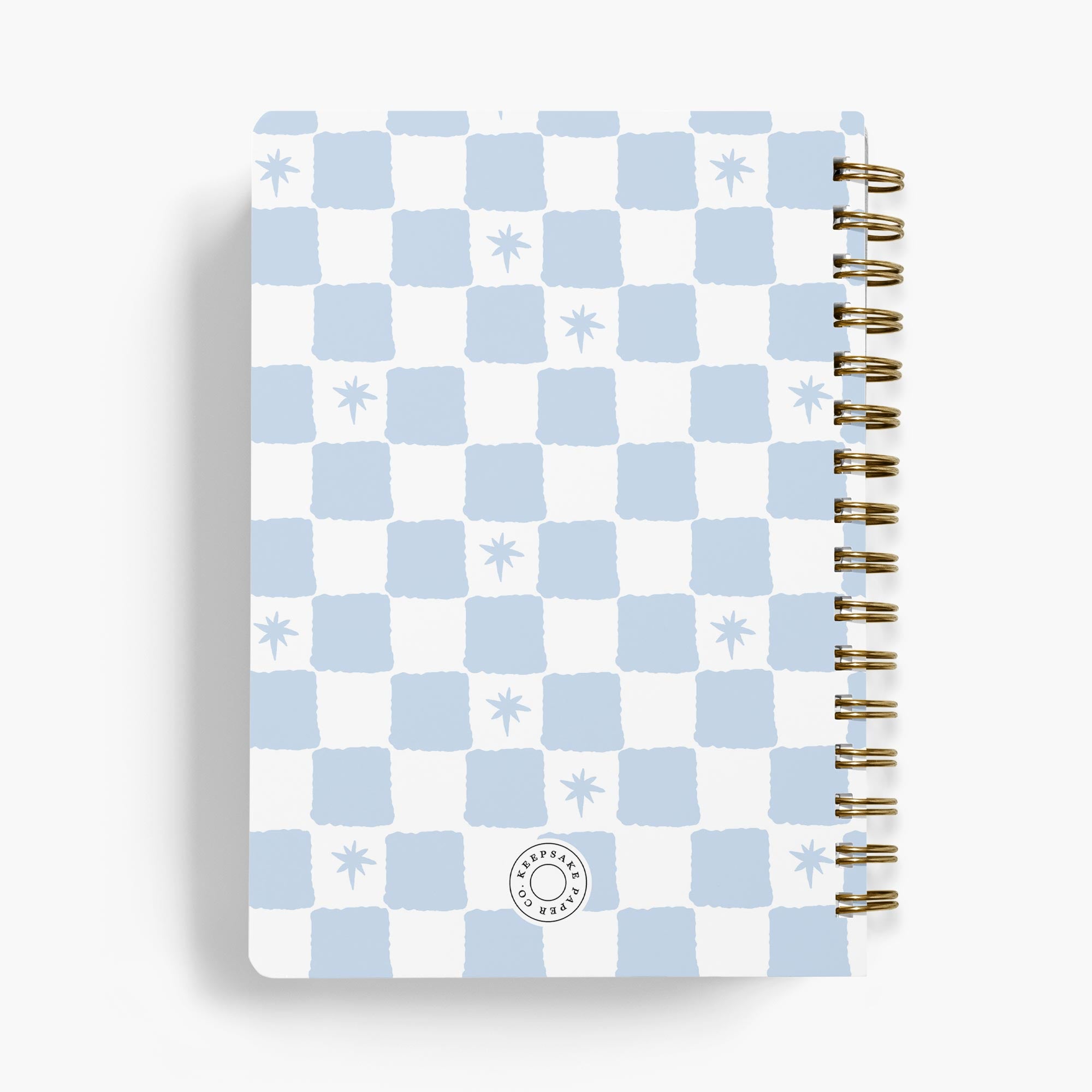 Checkered personalized recipe notebook with gold spiral binding on a white background