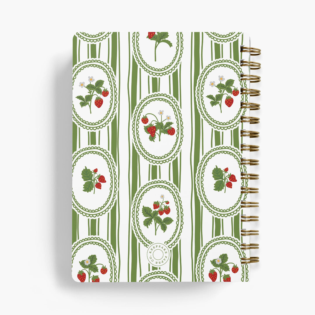 Custom cookbook with strawberry pattern on a white background
