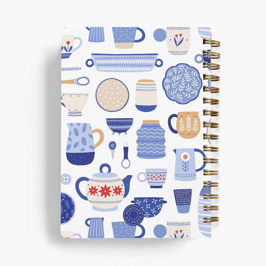 Personalized recipe notebook with blue and white kitchen utensils and dishes bound in gold wire
