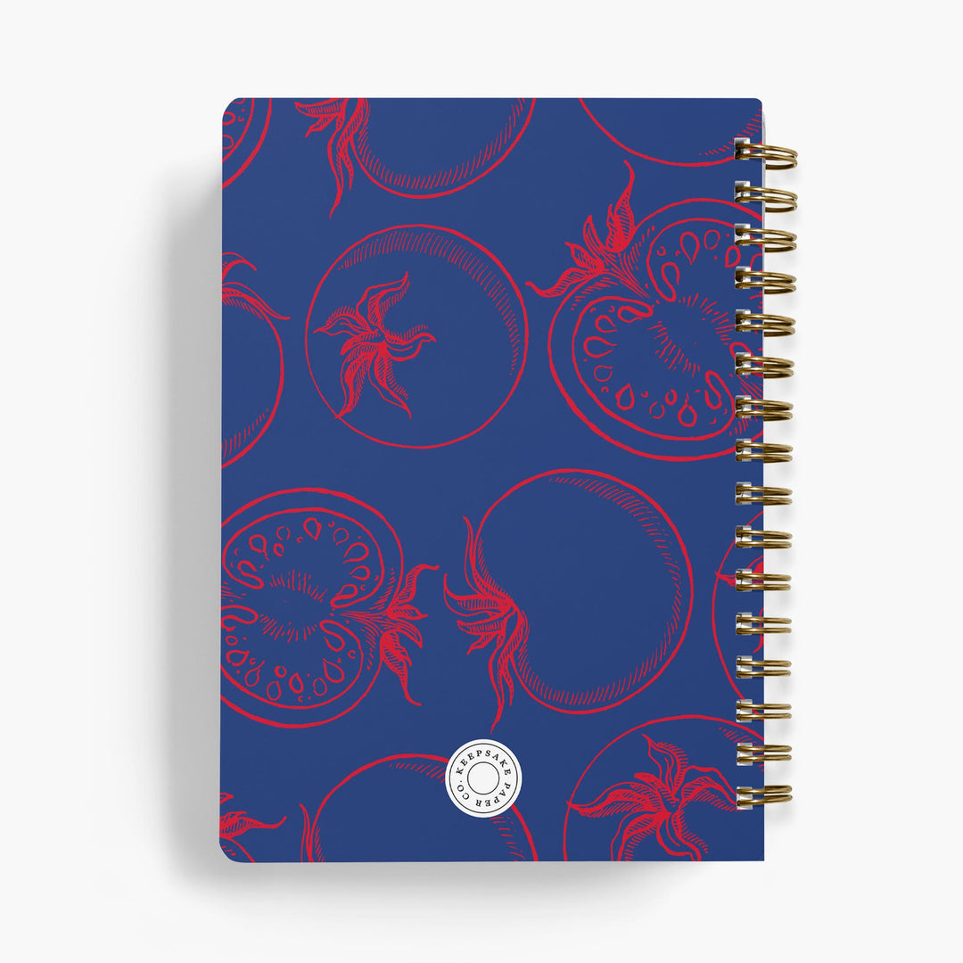 Personalized recipe notebook with red tomato pattern on a navy cover